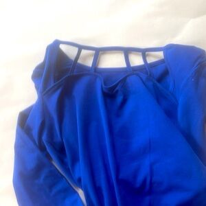 Colbalt blue l/s top with “caged” cut outs.
